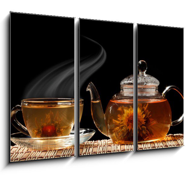Glass teapot and a cup of green tea on a black background