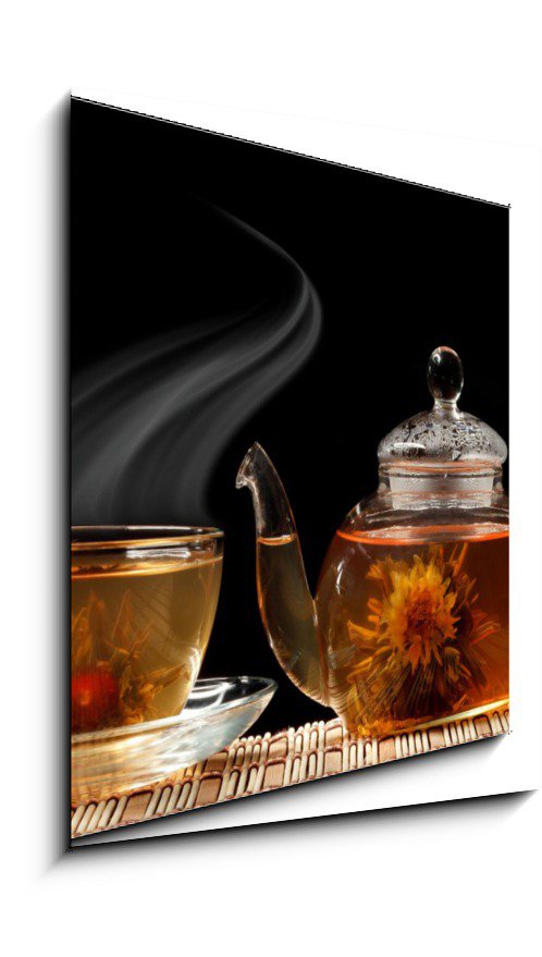 Glass teapot and a cup of green tea on a black background