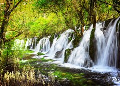 Fototapeta vliesov 200 x 144, 107722539 - Scenic waterfall with crystal clear water among green forest