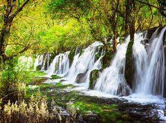 Fototapeta vliesov 270 x 200, 107722539 - Scenic waterfall with crystal clear water among green forest