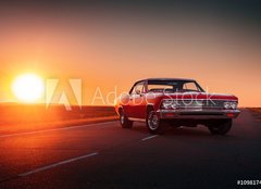 Fototapeta plátno 160 x 116, 109817494 - Retro red car standing on asphalt road at sunset - Retro červené auto stojí na asfaltové cestě při západu slunce