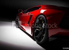 Samolepka flie 100 x 73, 115248334 - Red fast sports car in spotlight, black background. Shiny, new, luxurious. - erven rychl sportovn auto v reflektoru, ern pozad. Leskl, nov, luxusn.