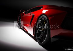 Fototapeta174 x 120  Red fast sports car in spotlight, black background. Shiny, new, luxurious., 174 x 120 cm