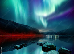 Fototapeta160 x 116  A large Northern Lights (aurora borealis) display glowing over a mountain pass and reflected on a lake at night. Photo composition., 160 x 116 cm