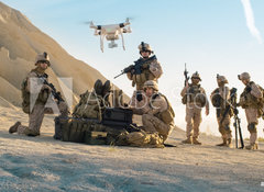 Samolepka flie 100 x 73, 164038449 - Soldiers are Using Drone for Scouting During Military Operation in the Desert. - Vojci pouvaj dron ke skautingu bhem vojensk operace v pouti.