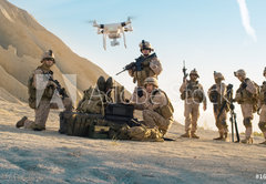 Fototapeta pltno 174 x 120, 164038449 - Soldiers are Using Drone for Scouting During Military Operation in the Desert.