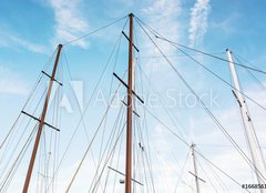 Fototapeta pltno 160 x 116, 166856176 - Masts of sailboat and blue sky - Story plachetnice a modr oblohy