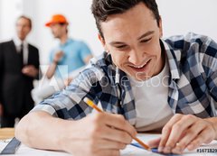 Samolepka flie 200 x 144, 167182957 - Close up of young architect drawing a line - Zblzka mladho architekta kreslen ry