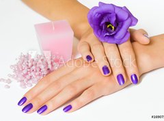 Fototapeta360 x 266  Hands with purple manicure and flower, pink candle and beads, 360 x 266 cm