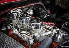 Fototapeta pltno 174 x 120, 170543646 - Under the Hood View of Restored Vintage Automobile Engine with Tri-Power Show-Chrome Carburetors