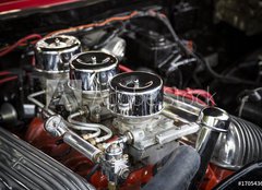 Fototapeta pltno 240 x 174, 170543646 - Under the Hood View of Restored Vintage Automobile Engine with Tri-Power Show-Chrome Carburetors