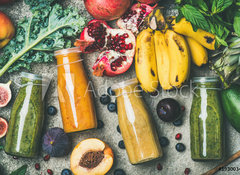 Samolepka flie 100 x 73  Flat lay of colorful smoothies in bottles with fresh tropical fruit and vegetables on concrete background, top view. Healthy, clean eating, vegan, vegetarian, detox, dieting breakfast food concept, 100 x 73 cm