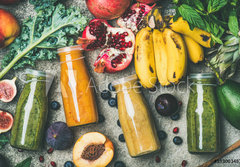 Fototapeta papr 184 x 128, 193003487 - Flat-lay of colorful smoothies in bottles with fresh tropical fruit and vegetables on concrete background, top view. Healthy, clean eating, vegan, vegetarian, detox, dieting breakfast food concept - ploch