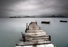 Fototapeta pltno 174 x 120, 19438246 - Looking over a desolate peer and a boat