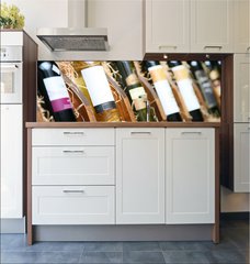 Fototapeta do kuchyn flie 180 x 60  Closeup shot of wineshelf. Bottles lay over straw., 180 x 60 cm