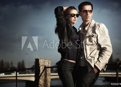 Fototapeta200 x 144  Attractive young couple wearing sunglasses, 200 x 144 cm