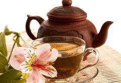 Samolepka flie 145 x 100  Cup of green tea on the table with orchid flower, 145 x 100 cm