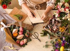 Samolepka flie 270 x 200, 266667837 - Florist writing in notebook at table
