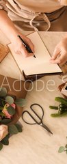 Samolepka na dvee flie 90 x 220, 266667837 - Florist writing in notebook at table