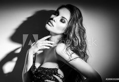 Fototapeta pltno 174 x 120, 289833288 - Sexy Young Woman black and white portrait. Seductive young woman in lingerie in darkness. Glamour lady with long hair posing in spotlight. Gorgeous seductive model girl with long hair b
