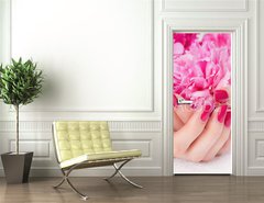 Samolepka na dvee flie 90 x 220  Woman cupped hands with pink manicure holding a flower, 90 x 220 cm