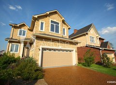 Fototapeta100 x 73  Two new two storied beige stone and brick cottage with garage, 100 x 73 cm