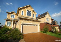 Fototapeta vliesov 145 x 100, 34945489 - Two new two-storied beige stone and brick cottage with garage