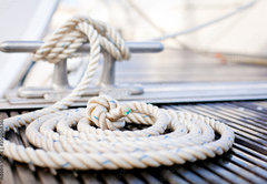 Fototapeta pltno 174 x 120, 35006836 - Mooring rope with a knotted end tied around a cleat.