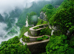 Fototapeta plátno 160 x 116, 384734369 - The winding road of Tianmen mountain national park (Zhangjiajie) in clouds mist, Hunan province, China