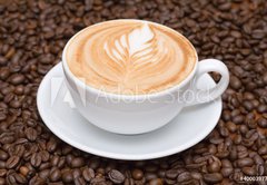 Fototapeta145 x 100  Coffee cup with coffee beans background, 145 x 100 cm