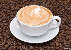 Fototapeta184 x 128  Coffee cup with coffee beans background, 184 x 128 cm