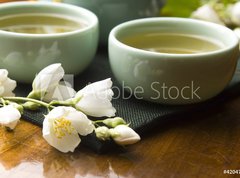 Samolepka flie 270 x 200, 42047983 - Green tea with jasmine in cup and teapot on wooden table