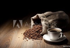Fototapeta184 x 128  Coffee cup with burlap sack of roasted beans on rustic table, 184 x 128 cm