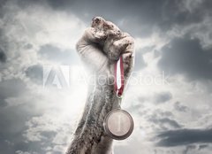 Fototapeta pltno 160 x 116, 44192642 - Male hand holding gold medal against the dramatic sky