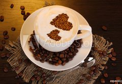 Fototapeta184 x 128  Latte on wooden table on brown background, 184 x 128 cm