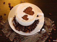 Fototapeta330 x 244  Latte on wooden table on brown background, 330 x 244 cm
