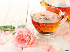 Samolepka flie 270 x 200  teapot and cup of tea with roses on white wooden table, 270 x 200 cm