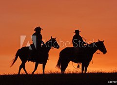 Samolepka flie 100 x 73, 47782535 - Cowboys on Horseback Silhouette at sunset