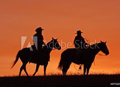 Fototapeta160 x 116  Cowboys on Horseback Silhouette at sunset, 160 x 116 cm