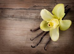 Fototapeta100 x 73  Vanilla Pods and Flower over Wooden Background, 100 x 73 cm