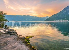 Fototapeta100 x 73  Sunset on the sea with the foggy mountains, 100 x 73 cm