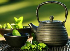 Fototapeta100 x 73  Black iron asian teapot with sprigs of mint for tea, 100 x 73 cm