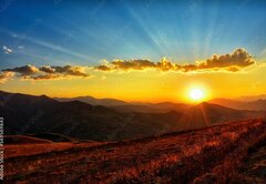 Fototapeta pltno 174 x 120, 569569643 - Beautiful sun set with sweet clouds between mountains