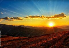 Fototapeta papr 184 x 128, 569569643 - Beautiful sun set with sweet clouds between mountains