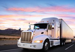 Fototapeta184 x 128  Truck and highway at sunset  transportation background, 184 x 128 cm