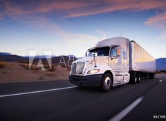 Fototapeta100 x 73  Truck and highway at sunset  transportation background, 100 x 73 cm