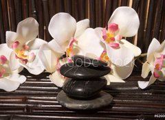 Fototapeta100 x 73  Massage stones and orchid flowers on bamboo, 100 x 73 cm