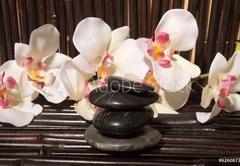 Fototapeta174 x 120  Massage stones and orchid flowers on bamboo, 174 x 120 cm