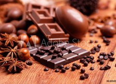 Fototapeta papr 254 x 184, 63094547 - uova pasquali e cioccolato assortito sul tavolo di legno - uva pasquali a cioccolato assortito sul tavolo di legno