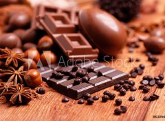 Fototapeta pltno 330 x 244, 63094547 - uova pasquali e cioccolato assortito sul tavolo di legno